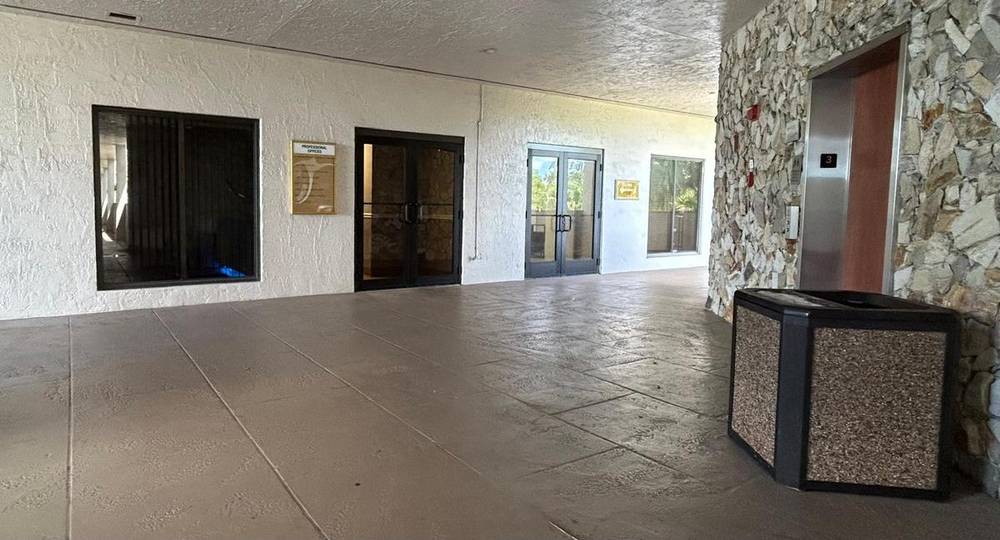 First floor hallway with elevator access